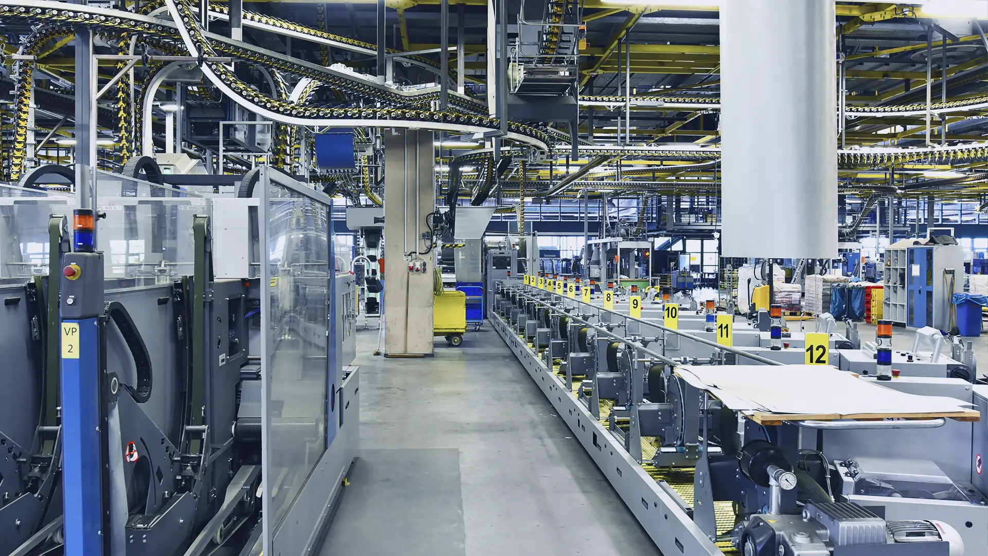 Production line with conveyor system in a factory hall
